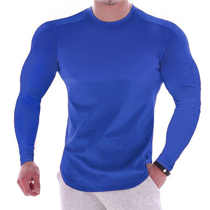 CAMISETA ESPORTIVA DE MANGA LONGA COM CORPO MARCADO, DE COR LISA, PARA HOMEM