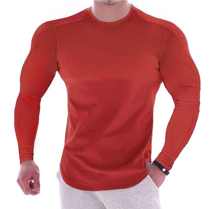 CAMISETA ESPORTIVA DE MANGA LONGA COM CORPO MARCADO, DE COR LISA, PARA HOMEM