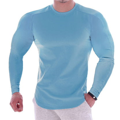 CAMISETA ESPORTIVA DE MANGA LONGA COM CORPO MARCADO, DE COR LISA, PARA HOMEM
