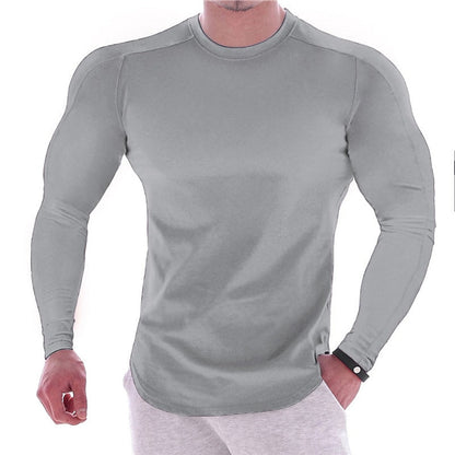 CAMISETA ESPORTIVA DE MANGA LONGA COM CORPO MARCADO, DE COR LISA, PARA HOMEM